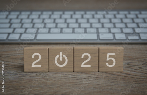 2025 start up business icon on wood block cubes on wooden table with modern computer keyboard, Happy new year 2025 online concept