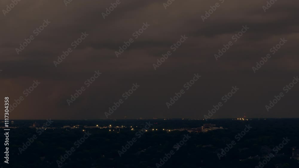 Drone wide shot of Stormy clouds sky before heavy rainfall and lightning over suburban town area. Drone wide shot of Stormy clouds sky before heavy rainfall and lightning over suburban town area.