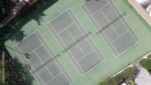 Tennis court with four courts and a net in the middle