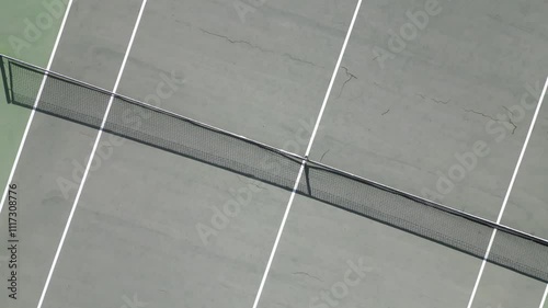 Tennis net is stretched across a court