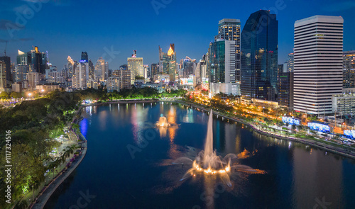 Aerial evening view from Benchakitti Park towards Asok in Bangkok, Thailand.