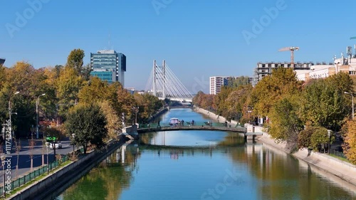 Gliding Above Dambovita River in Regie Neighborhood, Ciurel Bridge, Autumn, Bucharest, Romania photo
