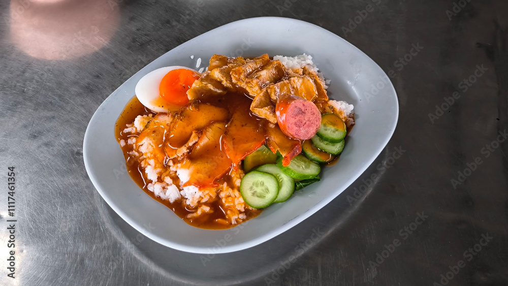 Red pork and crispy pork on rice, food in Thailand Red pork and crispy pork on rice, food in Thailand
