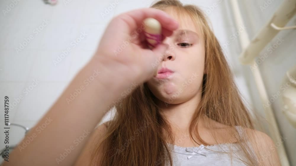 Portrait of child girl cleaning mouth with a toothbrush at bathroom Portrait of child girl cleaning mouth with a toothbrush at bathroom