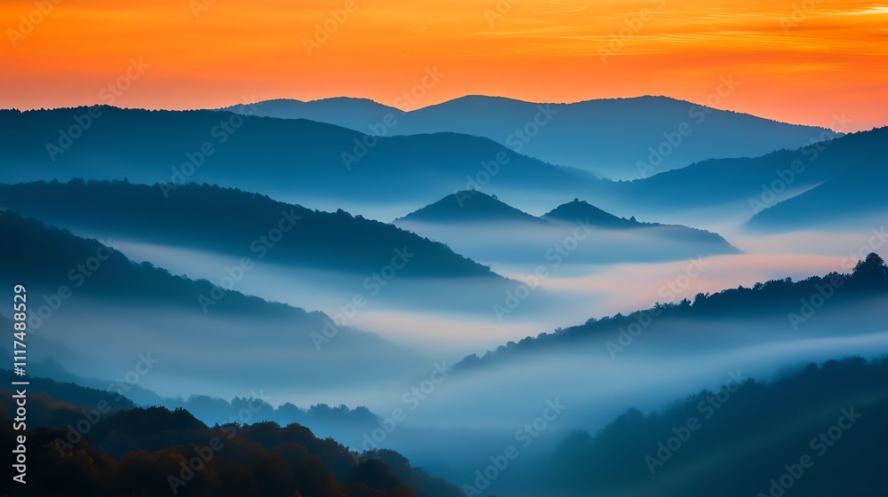 Serene mountain landscape at sunset with mist.