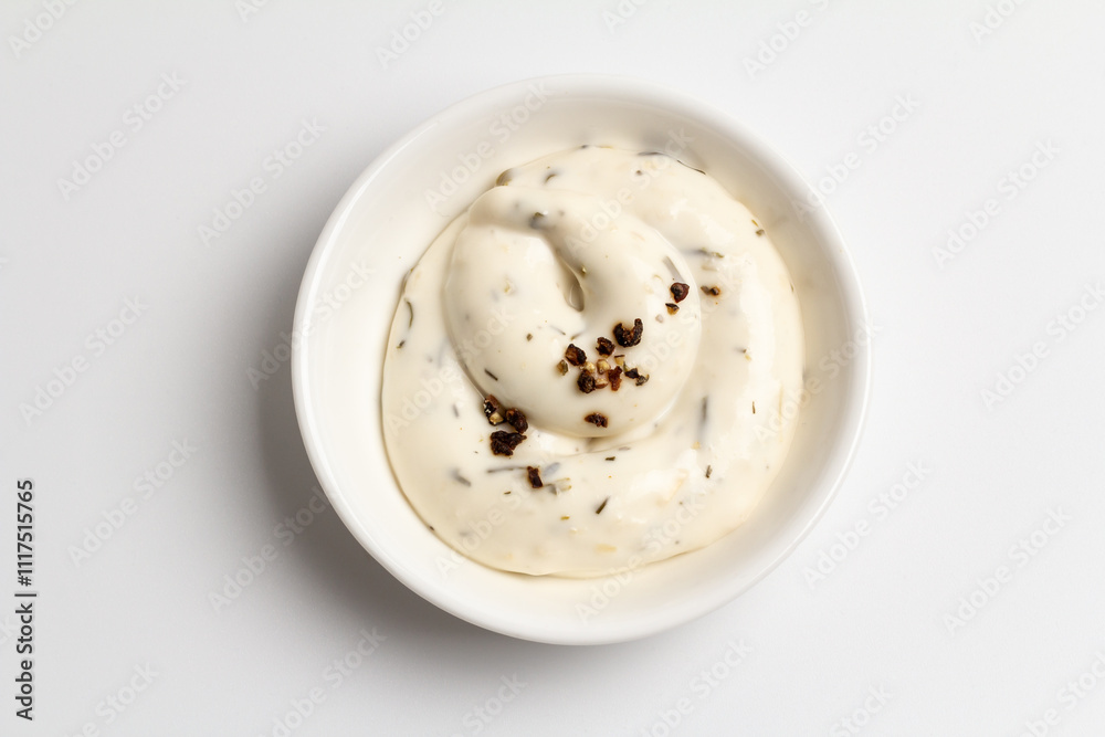White bowl with cheese sauce on the white background. White bowl with cheese sauce on the white background.