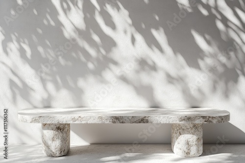 A minimalist stone bench casting shadows against a light wall. photo