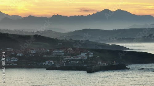 Sunset in Comillas, Cantabria. Cantabrian Sea. Mountains background