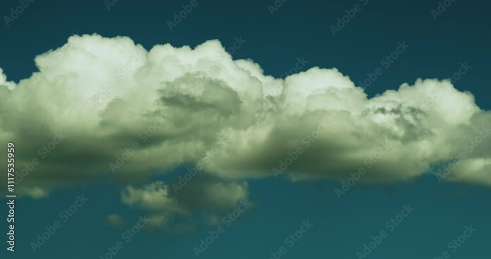 Timelapse of the blue sky with beautiful transforming and moving fluffy white cumulus cloud