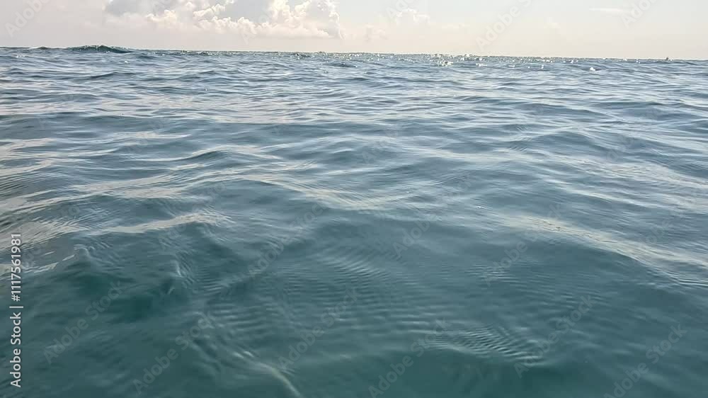 Ocean Water Surface Calm Waves - A photograph of the ocean surface with calm waves. Ocean Water Surface Calm Waves - A photograph of the ocean surface with calm waves.