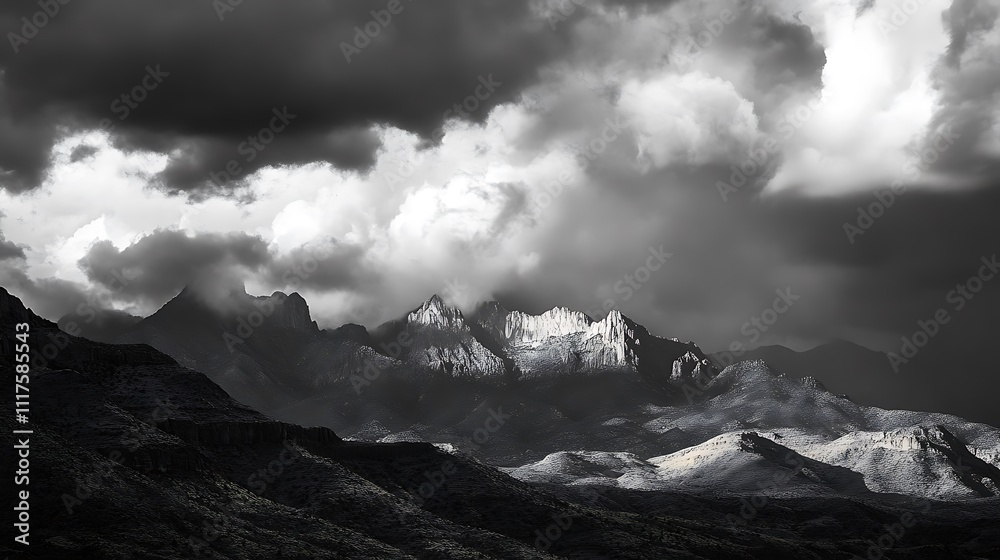 Obraz premium Dramatic Monochrome Mountainscape Under a Stormy Sky