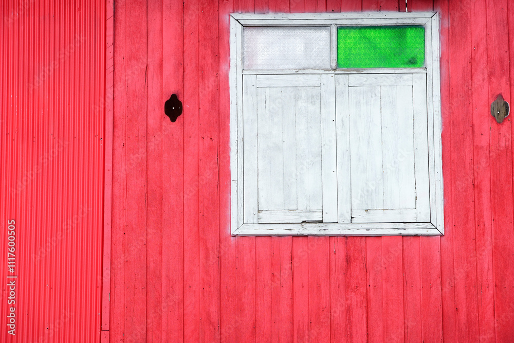 Colorful Red Wall with White Window and Green Glass Pane Detail Colorful Red Wall with White Window and Green Glass Pane Detail