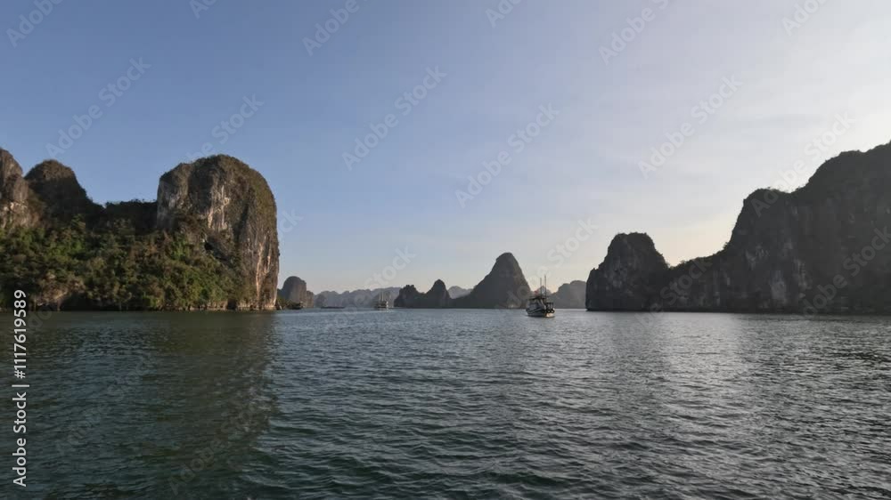 POV yacht moving on the sea at Ha Long Bay, Vietnam in sunset. POV yacht moving on the sea at Ha Long Bay, Vietnam in sunset.