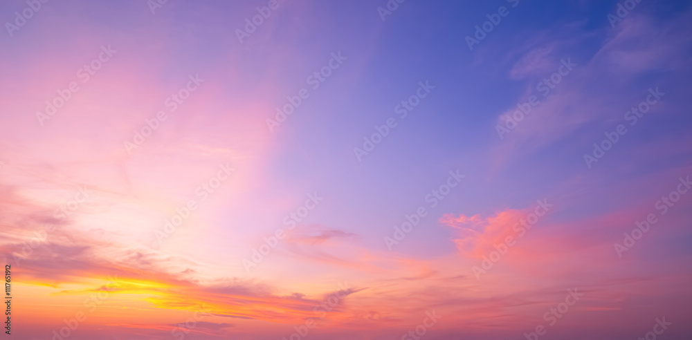 Sunrise sky background in early morning with dramatic clouds and colorful orange yellow sunlight on blue sky. Beautiful summer sunset horizon sky backdrop, Panoramic View Sunrise sky background in early morning with dramatic clouds and colorful orange yellow sunlight on blue sky. Beautiful summer sunset horizon sky backdrop, Panoramic View