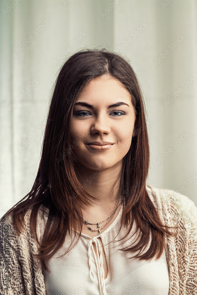 Young woman smiling and posing for a portrait Young woman smiling and posing for a portrait
