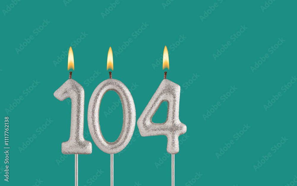 Birthday candle number 104 - Card on a green background. Birthday candle number 104 - Card on a green background.