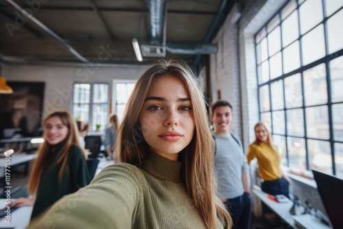 Woman taking a photo of herself in an office setting