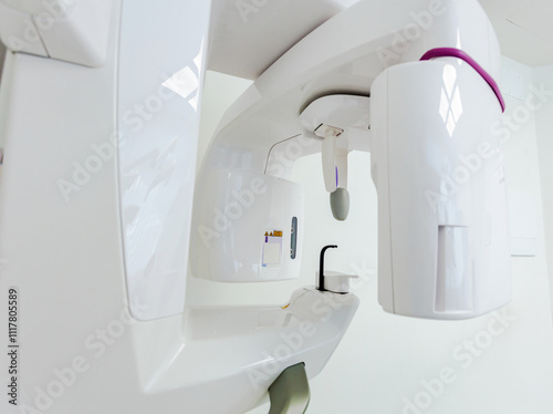 Modern dental clinic equipment performing a cone beam computed tomography scan