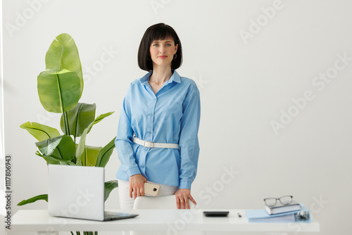 Confident business caucasian woman ceo wears formal clothes. Successful middle aged female with arms crossed standing by the office desk. Young professional executive manager, proud lawyer