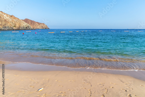 Fujairah, Khorfakkan sandy beach, United Arab Emirates. Oceanic Khorfakkan Resort Fujairah hotel sea beach vacation, Gulf of Oman, Indian Ocean.