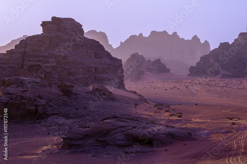Jordan, Wadi Rum desert or “Valley of the Moon”. Sunset in Wadi Rum desert with its bizarre boulders and endless sand dunes. Beautiful sky full of colors in rays of setting sun.