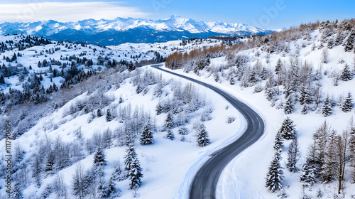 Snowy mountain road in winter landscape.