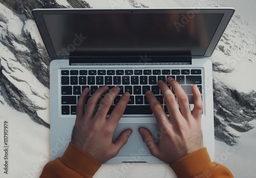 Hands on laptop on a table, top view photo