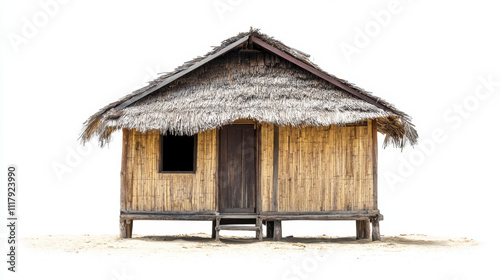 A traditional bamboo hut with a thatched roof stands isolated on a sandy surface, showcasing rustic architecture and simplicity.