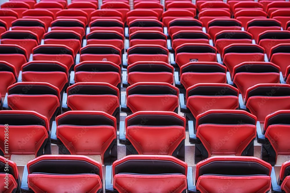 Perspective of many empty red stadium seats Perspective of many empty red stadium seats