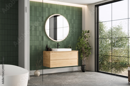 Minimalist bathroom design featuring green textured wall tiles, a wooden vanity with a round mirror, and a natural, modern atmosphere.