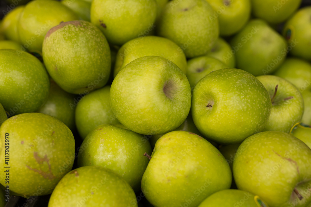 Delicious green apples on a market counter Delicious green apples on a market counter