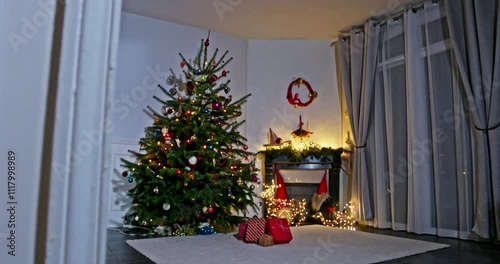 Xmas decor: tree with ornaments, wrapped gifts, and soft lights