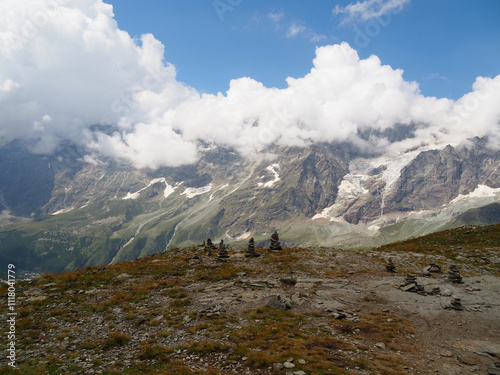 high mountain peaks covered by clouds photo