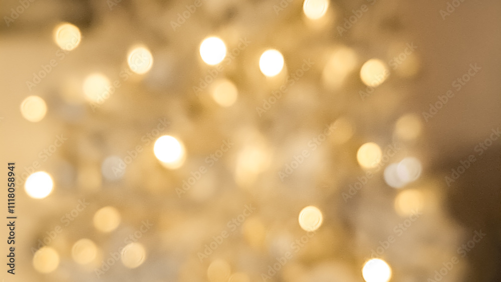 Fototapeta premium Abstract blurred golden and light brown bokeh glowing with festive warmth.