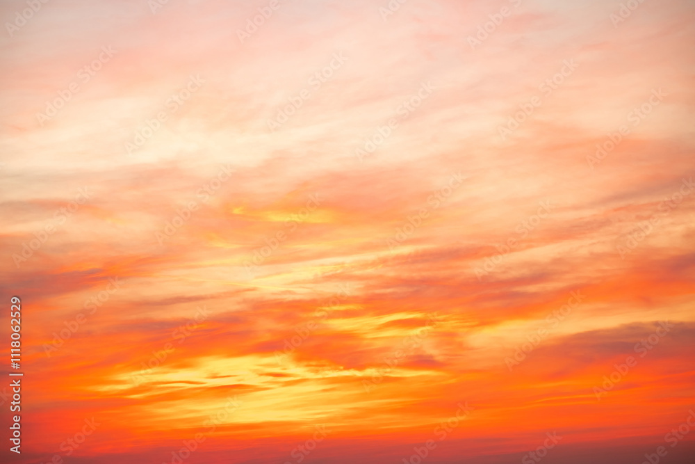 Fototapeta premium Sky,sunset, beautiful , luxury soft gradient orange gold clouds and sunlight on the blue sky perfect for the background, Sunrise on morning or everning in winter warm time ,Twilight summer,silhouette