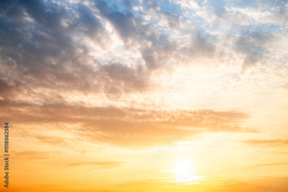 Obraz premium Sky,sunset, beautiful , luxury soft gradient orange gold clouds and sunlight on the blue sky perfect for the background, Sunrise on morning or everning in winter warm time ,Twilight summer,silhouette