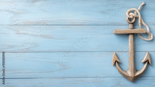 Wooden anchor tied with rope lies on a rich blue background, perfect for conveying nautical vibes while offering space for text photo