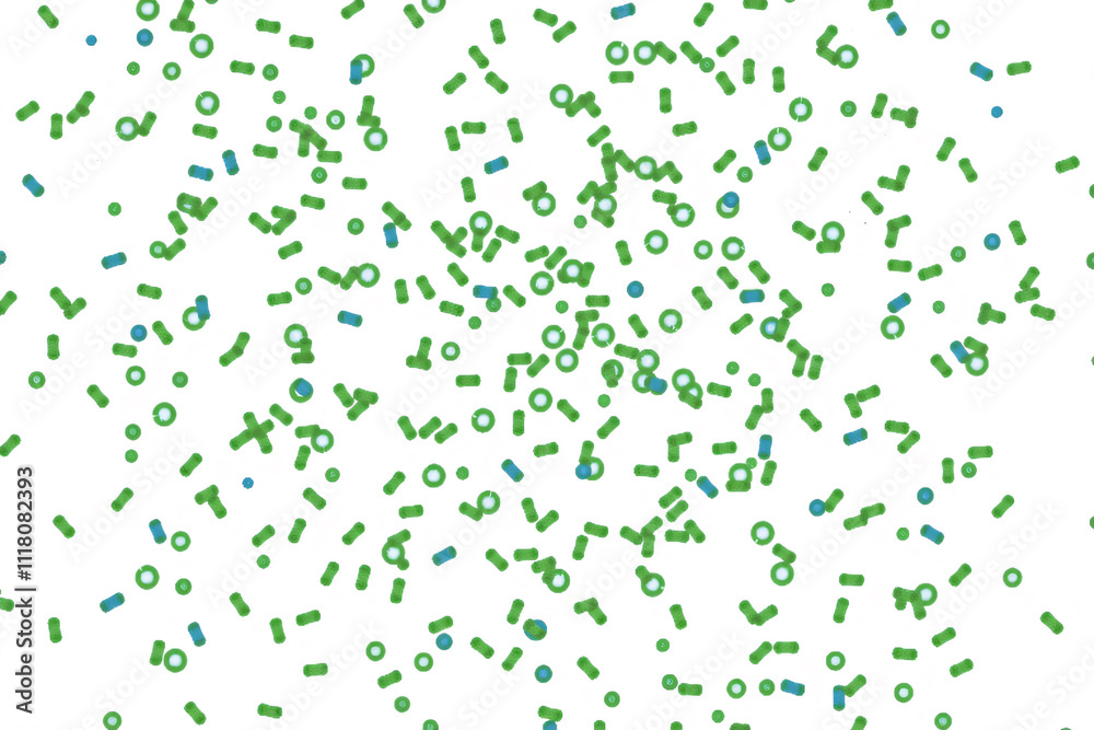 A top-down macro view of green and blue microbes bacterial on a white background A top-down macro view of green and blue microbes bacterial on a white background