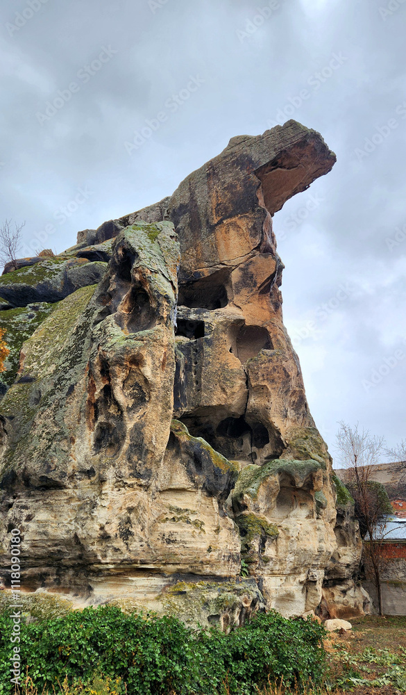 Rock-carved settlements in Uclerkayasi village in Ihsaniye districf of Afyonkarahisar prpvince in the evening of a rainy autumn day Rock-carved settlements in Uclerkayasi village in Ihsaniye districf of Afyonkarahisar prpvince in the evening of a rainy autumn day