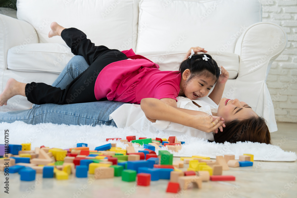 Cherry young mother plays colorful toy block with her Down syndrome daughter, colorful wooden toys can increase skills and learning to increase the development, special education, Knowing slowly Cherry young mother plays colorful toy block with her Down syndrome daughter, colorful wooden toys can increase skills and learning to increase the development, special education, Knowing slowly