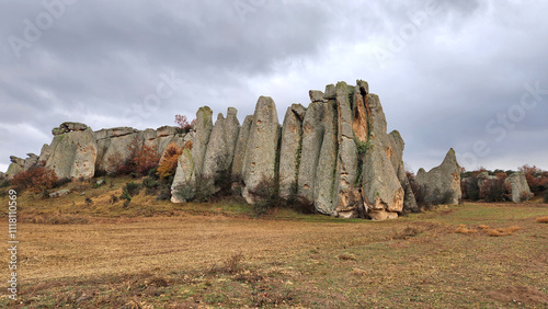 Beautiful rock formations in the west of famous Aslankaya Phyrgian Monument by the side of road to Doger town in Afyonkarahisar province in the evening of a severe rainy autumn day. photo