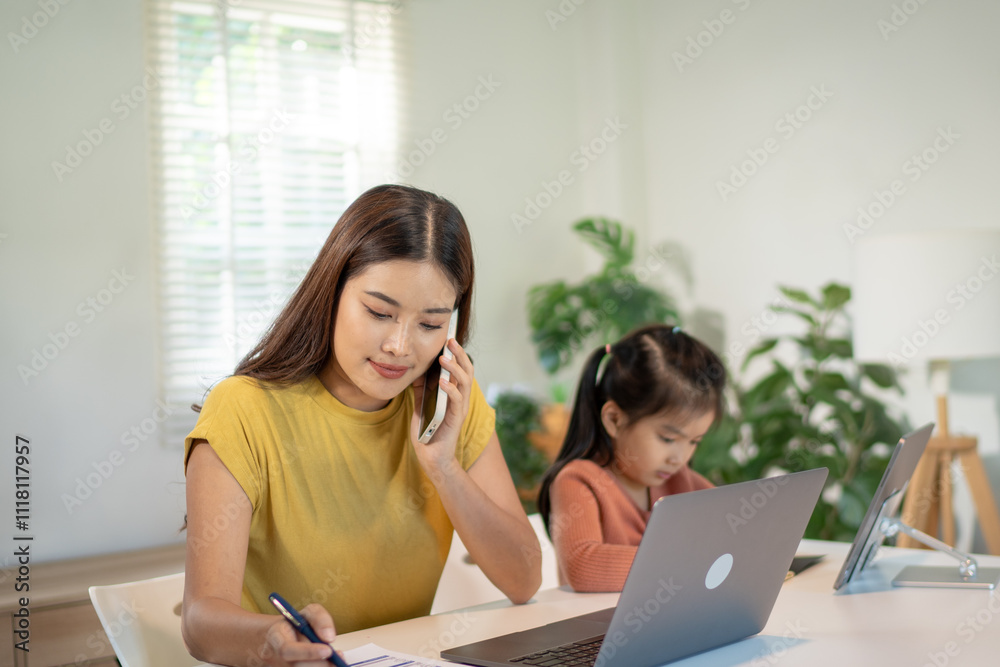 Lovely mom and little young daughter spending time together in their living room. Lovely mom and little young daughter spending time together in their living room.