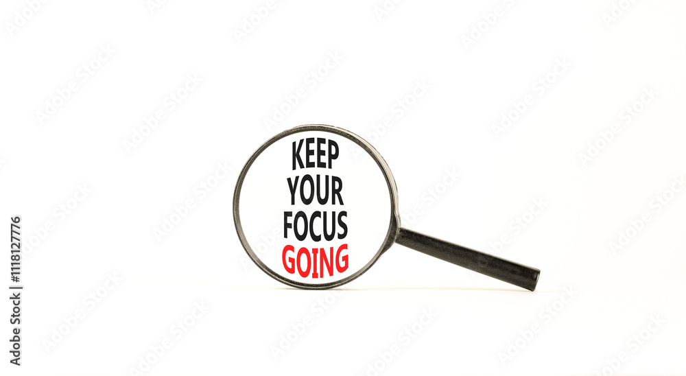 Keep your focus going symbol. Concept words Keep your focus going on beautiful magnifying glass. Beautiful white table white background. Business and keep your focus going concept. Copy space. Keep your focus going symbol. Concept words Keep your focus going on beautiful magnifying glass. Beautiful white table white background. Business and keep your focus going concept. Copy space.