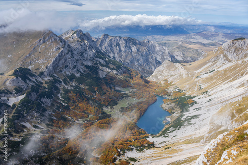 The most beautiful place in the Durmitor mountains, mystical mists, beautiful mountain lake (Veliko Skrcko Jezero), vast mountain ranges Bobotov Kuk area, hiking trail,  photo