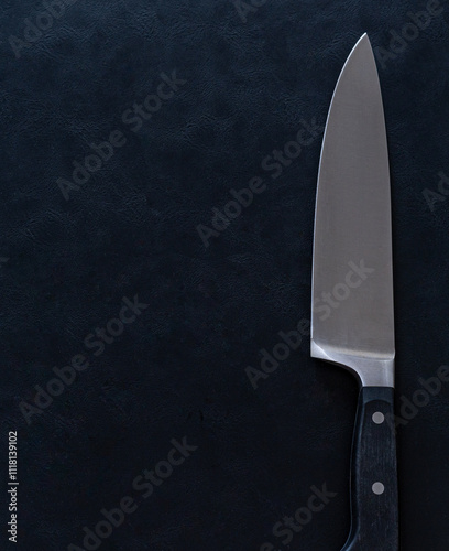 Sharp Kitchen Knife on Black Textured Background