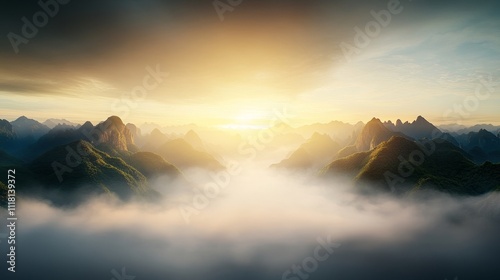 The sky is orange and the mountains are covered in fog