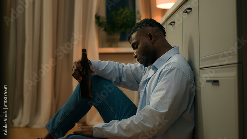 Bilde på lerret Sad upset African American man drunk male addicted guy alcohol addiction drinkin