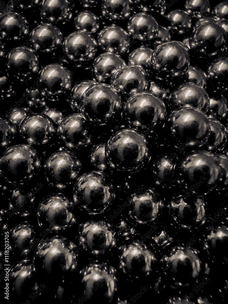 Pile of black shiny magnetic balls. Pile of black shiny magnetic balls.