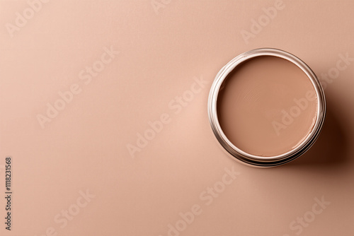 open can of wall paint in muted mocha brown color on a muted mocha brown background top view, 2025 color trend
