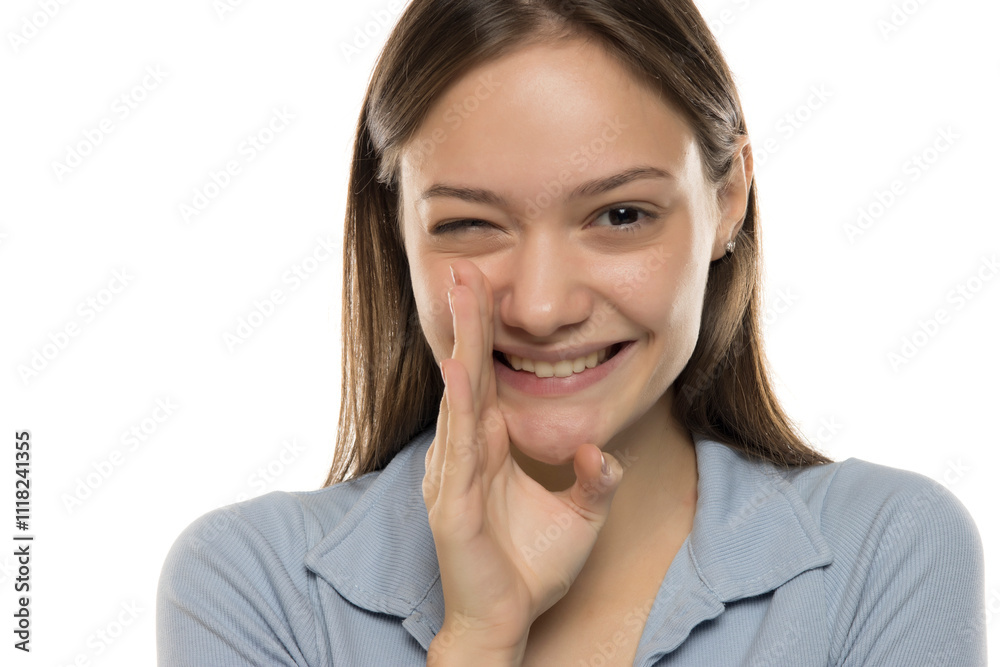 Portrait of whispering young woman on white Portrait of whispering young woman on white